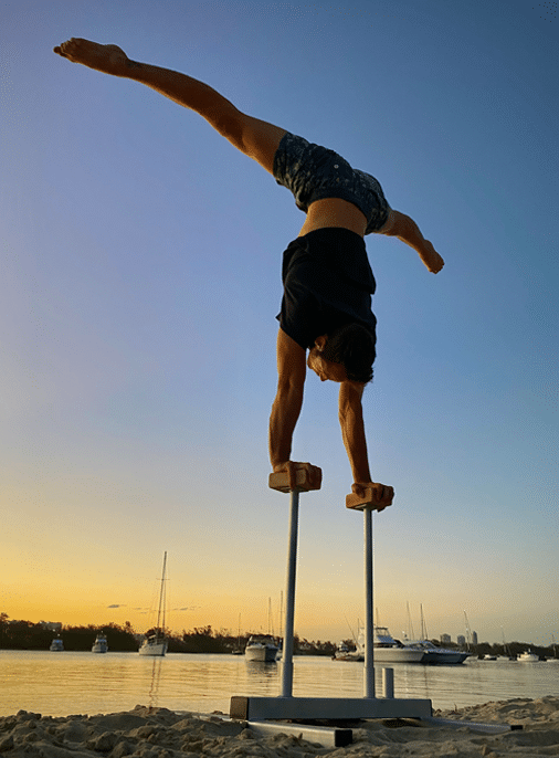 Riley doing a handstand on the Trix Circus handstand canes.
